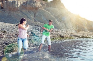 couple-playing-in-water
